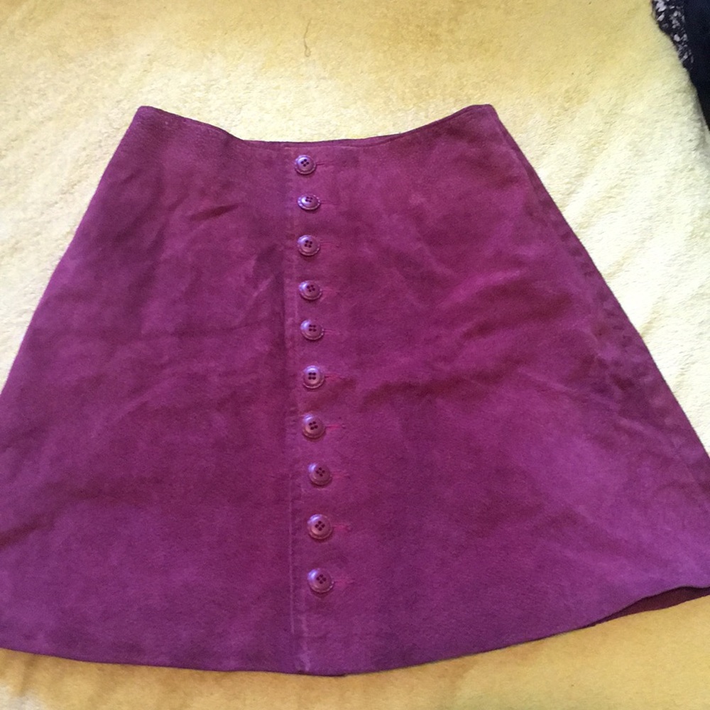 A nylon fuschia skirt with leather lining